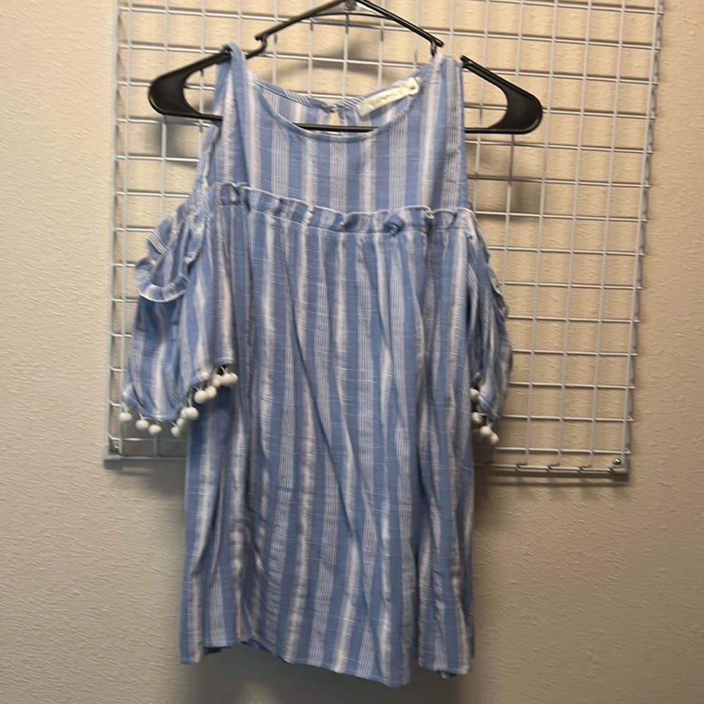 Cold shoulder top. Cute Pom poms around the sleeves blue and white pinstripes